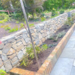 stonewall-brick-trim-slate-walkway